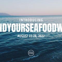 Text: Introducing #FindYourSeafoodWeek August 22-28,2022. Background shows the ocean with gentle waves and a mountain in the background.