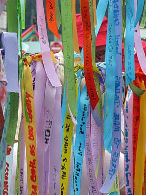 colorful ribbons with the people's climate march in the background.