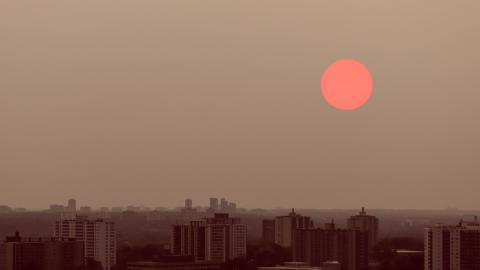 Smoky haze and a red sun over Toronto