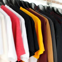 A rack of t shirts on hangers