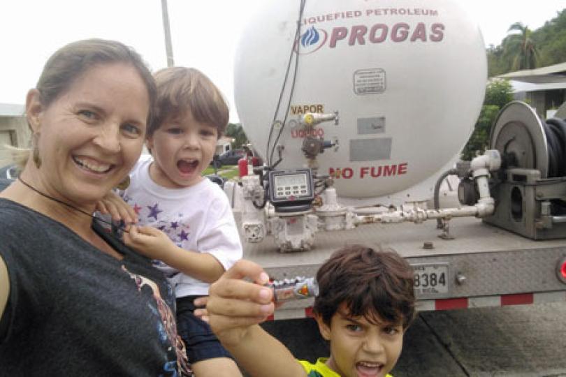 After two days on rotation with their neighbors sitting on the main street watching for the gas delivery truck, this was the family's look of joy when it arrived for the first time since the hurricane. They were down to 3%.